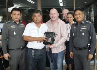 James Richardson is all smiles because taxi driver Vichai Taweekan rescued his vacation after the Brit left his belongings in the cab.