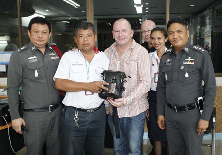 James Richardson is all smiles because taxi driver Vichai Taweekan rescued his vacation after the Brit left his belongings in the cab.