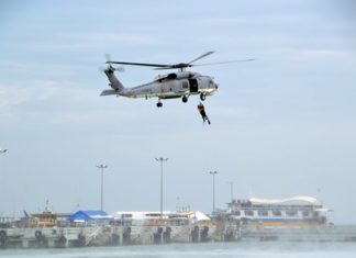 A helicopter from Naval Base 1 demonstrates how to rescue people at sea.