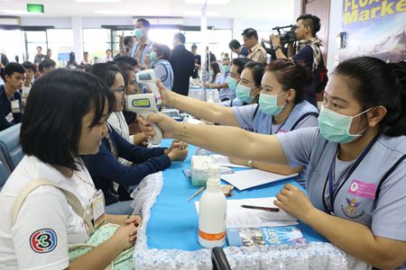 Health workers practice an emergency response in case airline passengers infected with Ebola are redirected to U-Tapao-Pattaya International Airport.