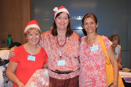 (L to R) Joyce Aldridge, Helle Rantsen, and Catherine Bollee from PILC can do a little Christmas shopping in between helping to run the bazaar.