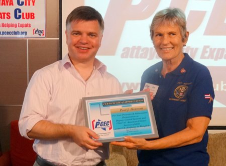 Board member Pat Koester, who is also a US Embassy Warden for Pattaya, presents the PCEC’s certificate of appreciation for Paul Herman’s informative talk about the US Embassy’s American Citizens Services unit.