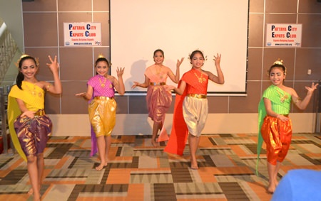 Five lovely young ladies from Pattaya Orphanage wearing traditional Thai garb perform a Thai dance for the PCEC audience.