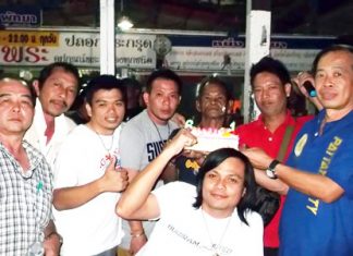 Pattaya Mail’s senior reporter Boonlua Chatree (back, center) celebrates his 60th birthday with friends at the Buffalo Market.
