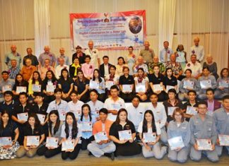 Volunteer teachers, organizers and trainees who have successfully completed the English Conversation for Better Life program gather for a group photo.