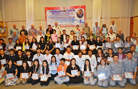 Volunteer teachers, organizers and trainees who have successfully completed the English Conversation for Better Life program gather for a group photo.