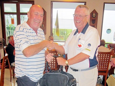 Dick Warberg (right) presents the MBMG Group Golfer of the Month award to Mike O’Brien.