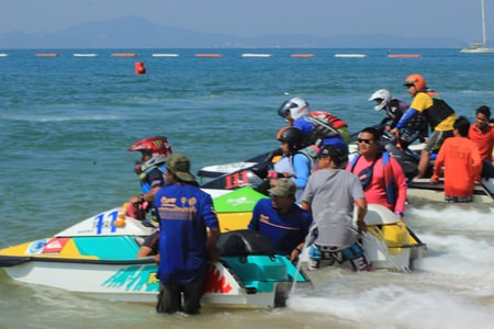 Jet-ski racers line up on the beach before the start of another heat.