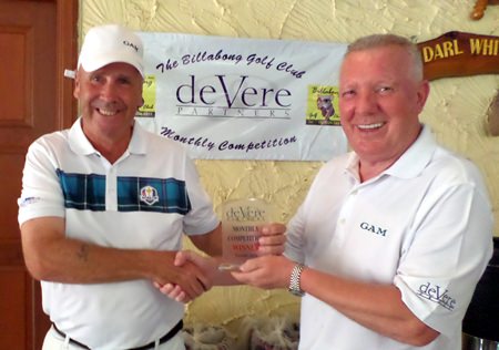 George Barrie (left) receives the deVere trophy for November from Brian Chapman.