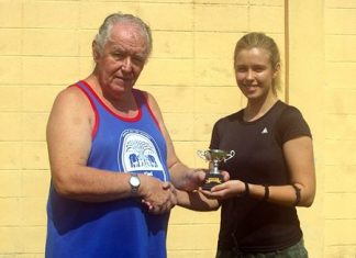 Dasha is presented with The President’s Cup by Eric Hearn.