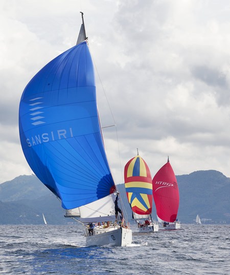 Sansiri Windstar leads the Classics fleet downwind at the 2014 Phuket King’s Cup Regatta. A record 150 individual races were completed at this year’s event. Turn to page 55 for a full Regatta round-up. (Photo by Guy Nowell)