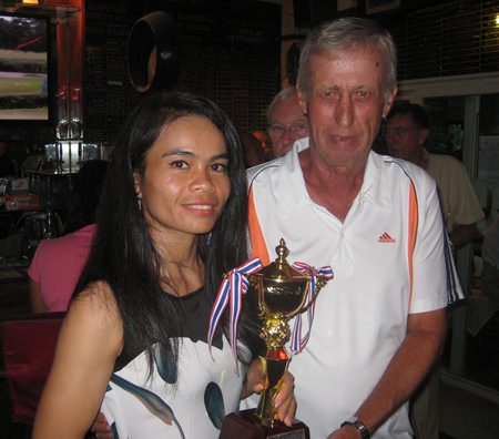 Duang Butpanya (left) receives the Ladies/Seniors trophy.