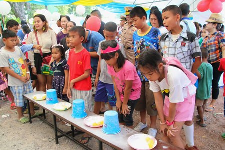 Children line up to play games and win prizes at the Sea Turtle Conservation Center in Sattahip.