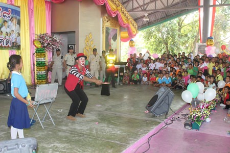 The Tuxedo Magician performs for an excited crowd in Nongprue.