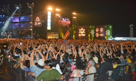 Fans show the famous Slot Machine band hand triangle.
