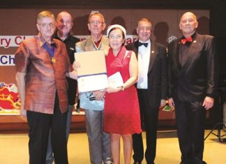 RCEB gets into holiday spirit at Siam Bayshore Radchada Chomjinda (center) receives the Paul Harris Fellowship from (from left) Martin Brands, Bob Denzel, Russel Iffland, Carl R. Dyson and Jan Abbink.
