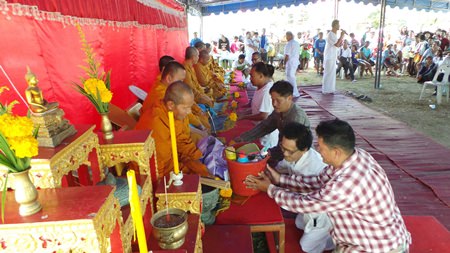 The Panrak family prayed, made merit and fed the monks lunch.