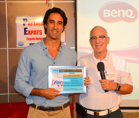 MC Richard Silverberg presents Aaron Siwoku with the PCEC’s Certificate of Appreciation for his informative talk about bitcoins and how cryptocurrency will change the future of banking.