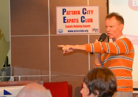 Club member Ren Lexander calls on a member of the PCEC audience with a question or comment about expat living in Pattaya during the Open Forum part of the Sunday meeting.