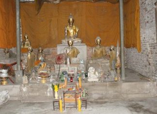 Buddha statues and other artifacts remain inside the ancient temple.