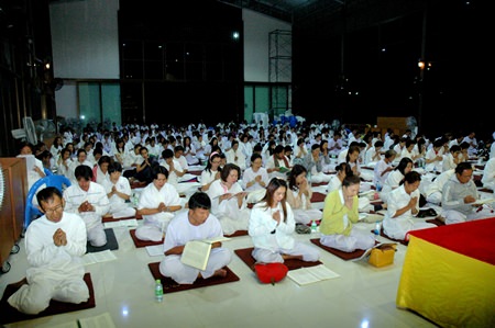 People pray at the Naklua Sutthipawan Forest Temple to welcome the New Year with clear minds and goodness.