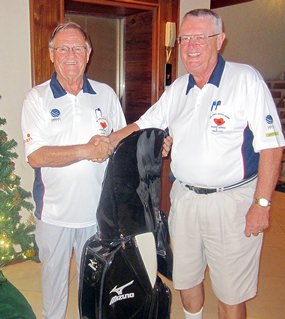 Dick Warberg (right) is presented with the MBMG Group Golfer of The Year award by Derek Brook.