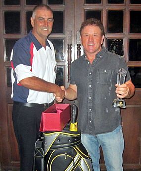 2015 Club Champion Paul Smith (right) is congratulated by PSC Golf Chairman Mark West.