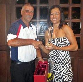 Mark West (left) presents the Ladies Champion’s trophy to Rotjana Neal.