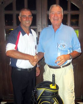 Club Seniors Champion Peter Henshaw (right) receives his prize.