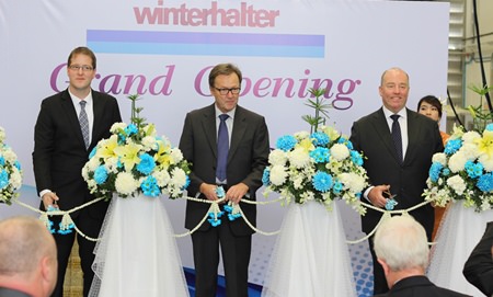 Tobias Wimmer, Managing Director Winterhalter Asia, Juergen Winterhalter, Owner and Managing Director Winterhalter, and German Ambassador Rolf Peter Gottfried Schulze cut the ribbon at the grand opening of Winterhalter Asia in Rayong.