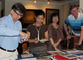 (L to R) Museum Specialist Sanchai Wongsarawanee, Team Executive Sumaivadee Merkasut, Senior Curator Suwapak Piriyapolkai and Jan Olav Aamlid studying the collection of artwork, master banknotes and specimens of Thai banknotes.