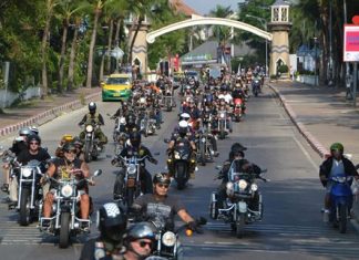 A caravan of over 100 big bikes rumbles down North Road onto Beach Road near the beginning of their Ride for Peace through Pattaya. The event kicked off the annual Burapa Bike Week promoting friendship and parties.