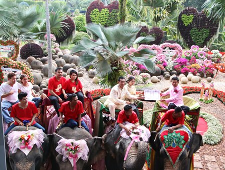 At Nong Nooch Tropical Garden, 79 couples rode their way into matrimony on the back of elephants.