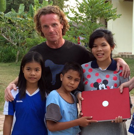 The children look pleased with David’s donation.