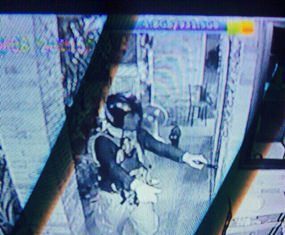 This still image taken from the security video camera allegedly shows Ayder Bezaziyev holding up the currency exchange shop.
