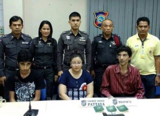 Adil Hueeani, his wife Surayya and one of their children are shown during the press briefing announcing their arrest.