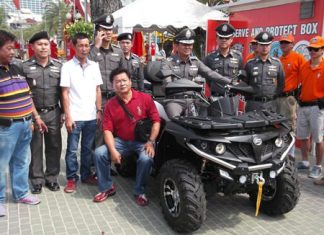 Chonburi police commander, Pol. Maj. Gen. Nitipong Niemnoy sits on the new CForce 550 ATV, preparing give it a spin.
