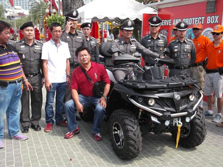 Chonburi police commander, Pol. Maj. Gen. Nitipong Niemnoy sits on the new CForce 550 ATV, preparing give it a spin.