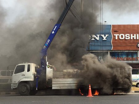 This careless crane driver touched high-voltage lines with the vehicle’s basket, setting off a fire that torched the truck’s back wheels.