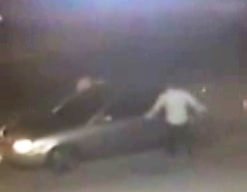 This still image taken from video shows the attackers trying to gain access to the car.