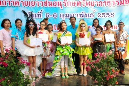 Winners of the “Miss Recycle” contest collect their rewards.