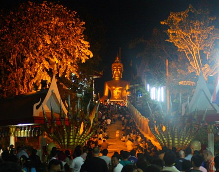 Pattaya Buddhists, shown here on “Buddha Hill” (Wat Khao Phra Yai) during last year’s event, will merit and parade with candles as the area celebrates Makha Bucha Day, one of the holiest days on the Buddhist calendar.