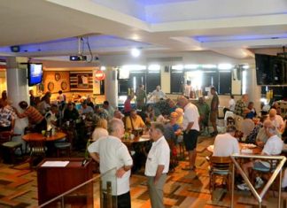 PCEC members and guests enjoy visiting with each other in the Amari’s Tavern by the Sea Restaurant pending the start of the club’s Sunday program.