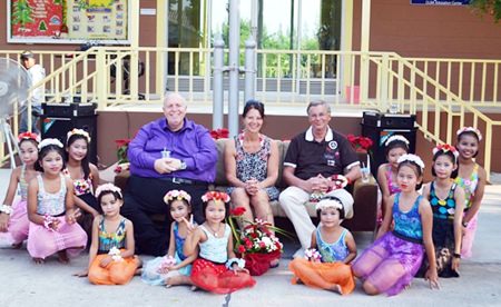 The VIPs sit with some children at the CPDC center.