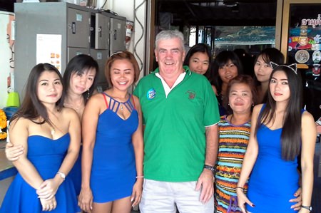 Russell (centre) poses with the staff at Blue Sky Bar.