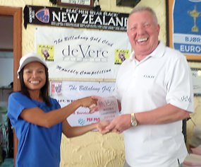 Orn (left) receives the deVere monthly trophy from Brian Chapman.