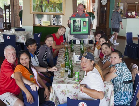 Neil Duncan (standing centre) holds the winner’s plaque as he and friends of Dennys pose for a group photo following the memorial tournament at Plutaluang.
