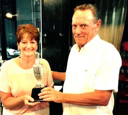 Ladies champion Kathleen Featherstone receives her trophy.