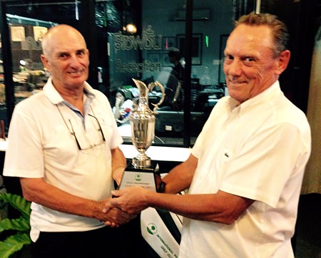 Net Champion John Carlin (left) receives his trophy from IPGC Chairman, Dave Thomas.