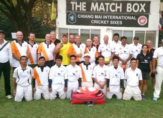 Pattaya Cricket Club players pose with the Lanna C.C. team at the Gymkhana ground in Chiang Mai, Feb. 15.